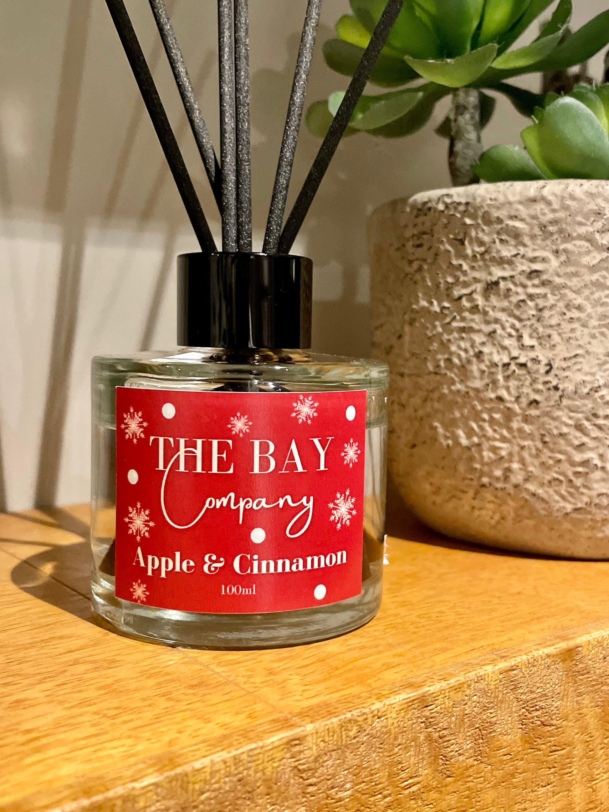 The Bay Company reed diffuser with a Christmas scent. Apple and cinnamon.