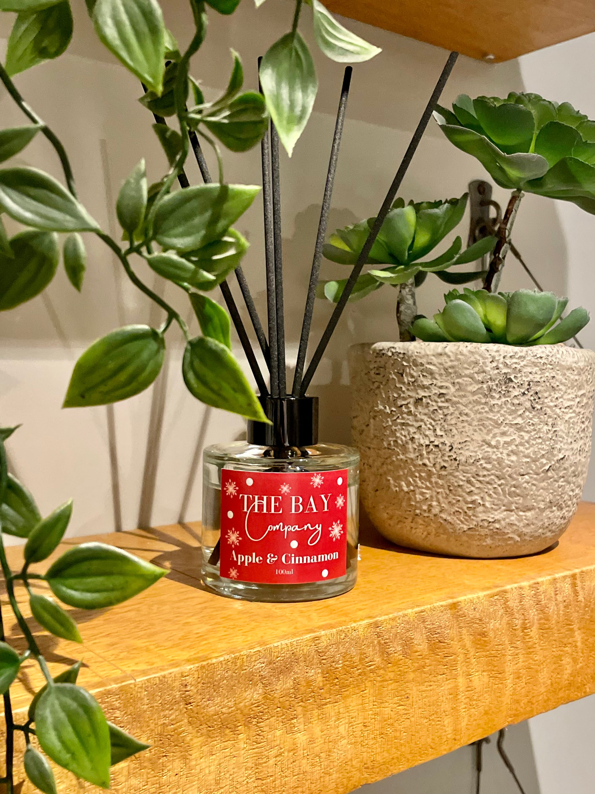 The Bay Company reed diffuser with a Christmas scent. Apple and cinnamon.