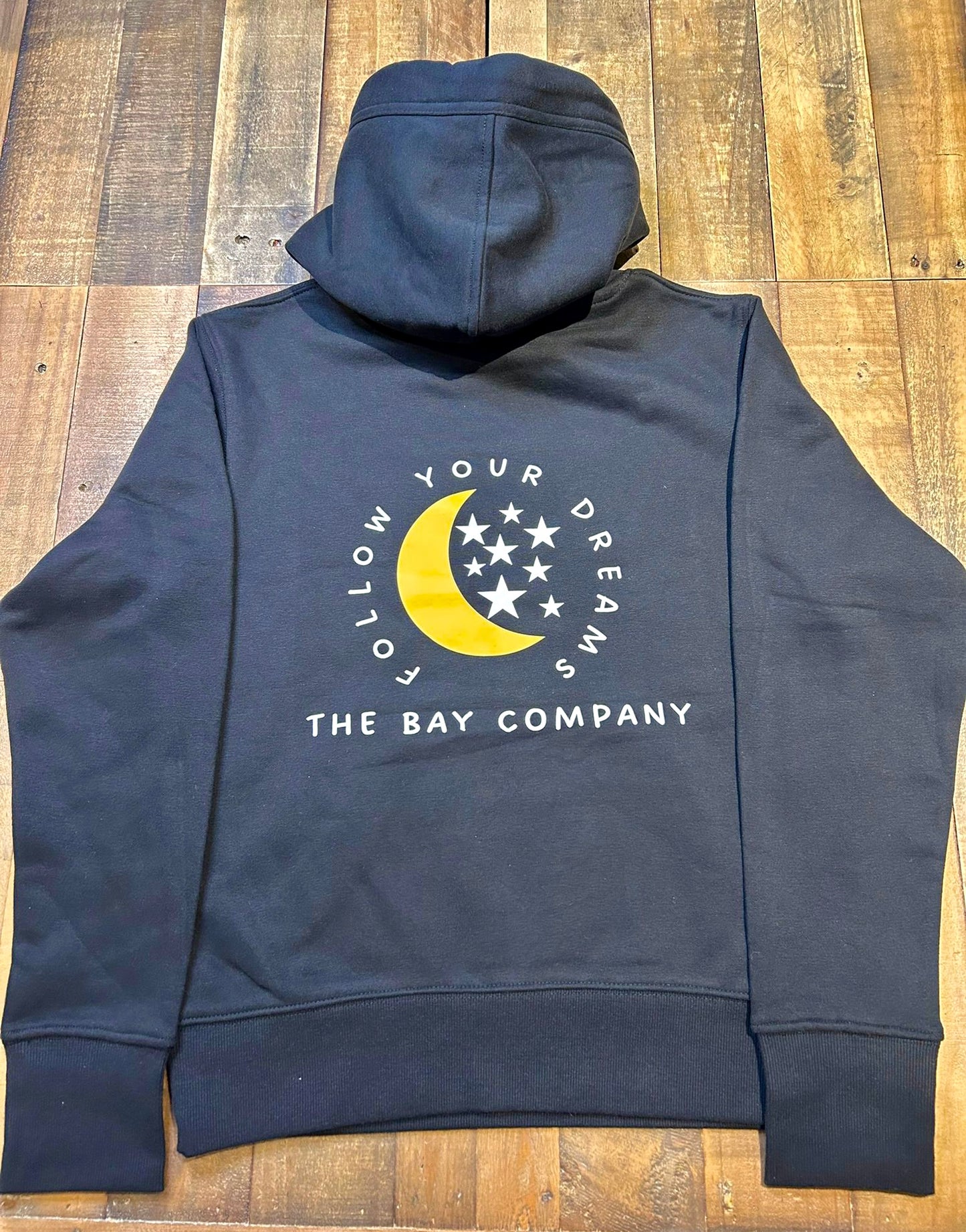 The black “follow your dreams” women’s hoodie from the bay company