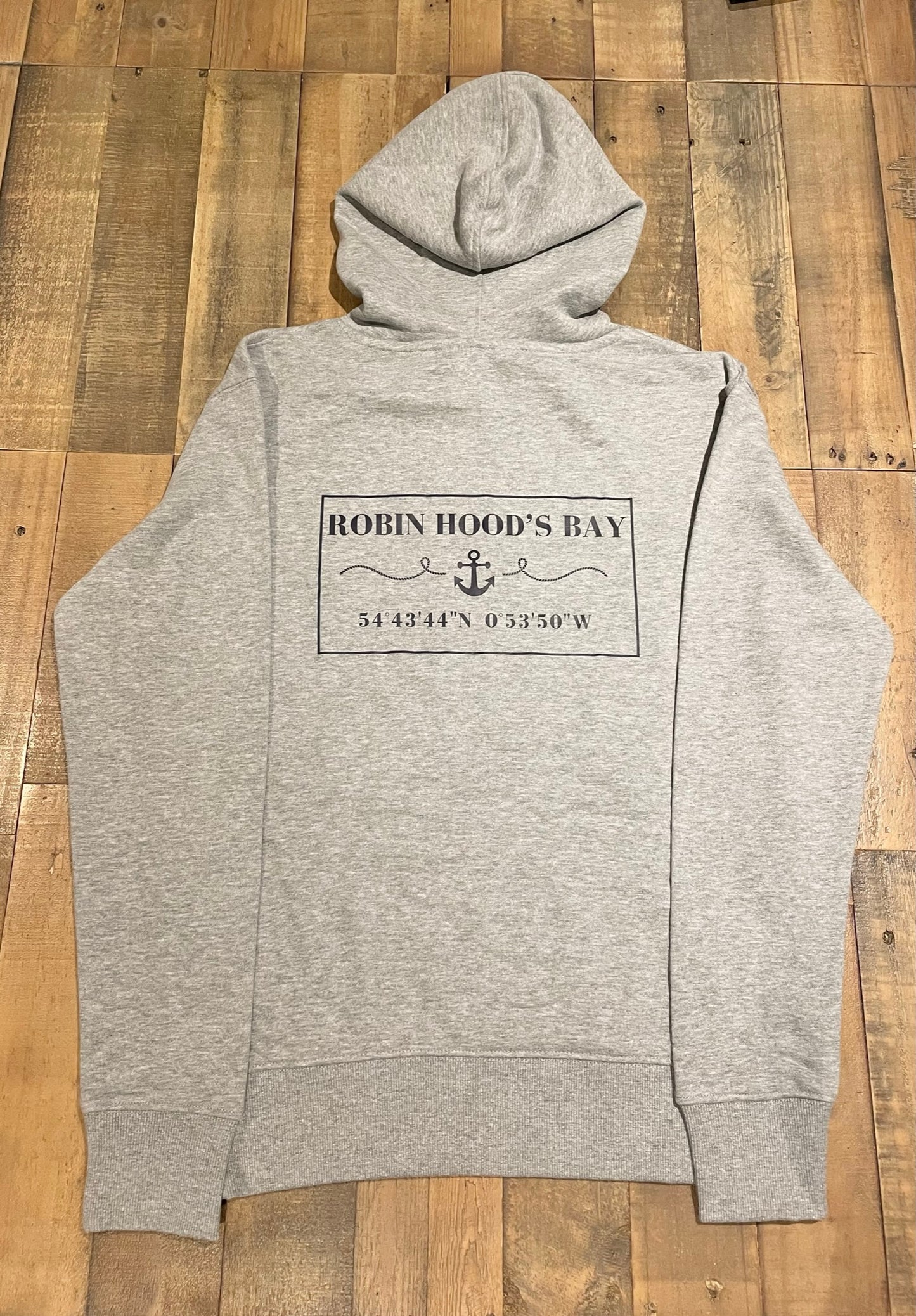 The grey “Robin Hood’s Bay” men’s hoodie from the bay company. 